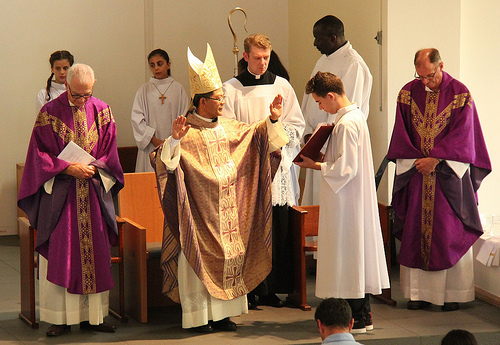 Bishop Vincent Long praying the Solemn Blessing